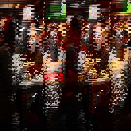 People laughing in Gibney's bar in Shoreditch, London