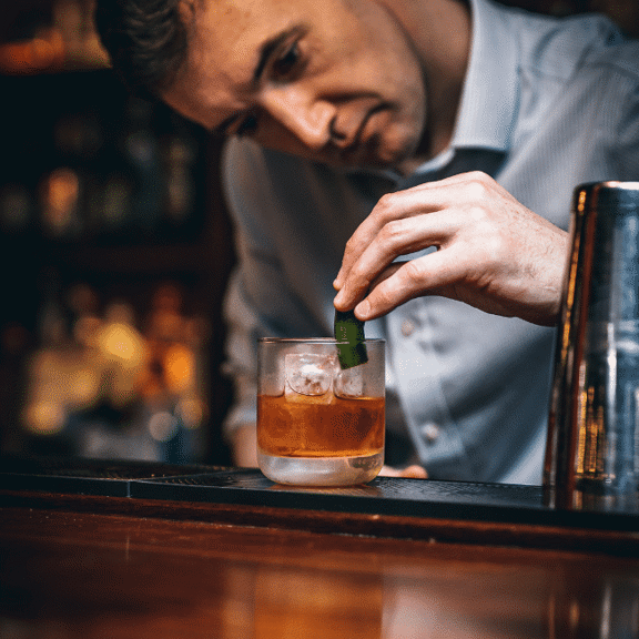 Bartender making a cocktail at Gibney's bar in Shoreditch