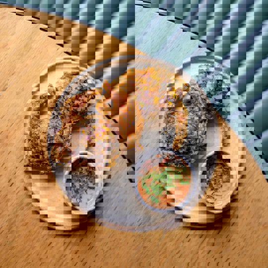 Fried crab on a plate with sauce from Daffodil Mulligan restaurant in Shoreditch