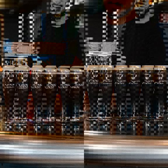 6 pints of Guinness on bar at Daffodil Mulligan restaurant in Shoreditch, London