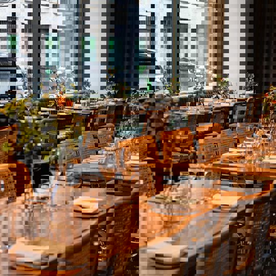 Interior Daffodil Mulligan restaurant in Shoreditch, London showing laid tables
